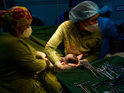 Doctors assist in a birth at the Ramón González Coro Maternity Hospital in Havana, Cuba, Friday, Feb. 20, 2026. 