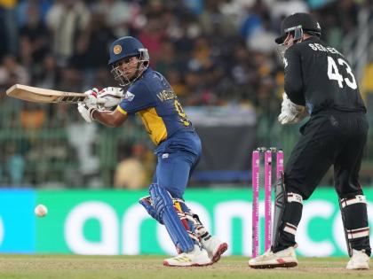 Sri Lanka’s Dunith Wellalage plays a shot during the T20 World Cup match against New Zealand in Colombo, Sri Lanka, yesterday. Looking on is New Zealand wicketkeeper Tim Seifert.