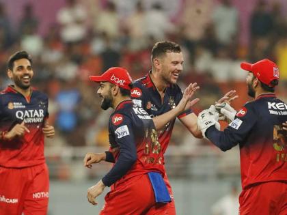 Royal Challengers’ Bengalaru’s Josh Hazlewood (second right) celebrates the dismissal of Pubjab Jings’ Azmatullah Omarzai with teammates during the Indian Premier League Qualifier 1 cricket match at Maharaja Yadavindra Singh Cricket Stadium in Mohali