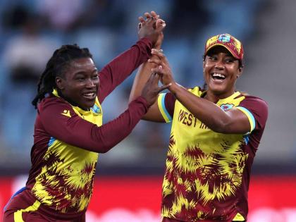 Deandra Dottin of West Indies celebrates running out Alice Capsey of England (not pictured) with teammate Hayley Matthews during the ICC Women’s T20 World Cup 2024 match against England in 2024.