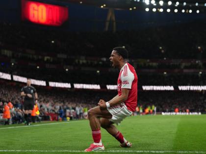 Arsenal’s Jurrien Timber celebrates after scoring during the English Premier League match against Chelsea in London yesterday. Arsenal won 2-1.