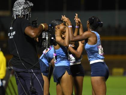 Edwin Allen’s quartet celebrates winning the 4x400-metre girls’ Open at the Gibson McCook Relays inside the National Stadium on Saturday. 