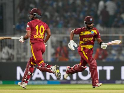 
West Indies’ captain Shai Hope (right) and batting partner Roston Chase run between the wickets during the T20 World Cup cricket match against India in Kolkata, India, on March 1.