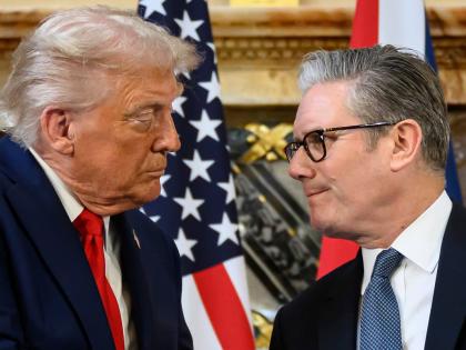 US President Donald Trump, left, and British Prime Minister Keir Starmer look at each other as they shake hands during a press conference at Chequers near Aylesbury, England on September 18, 2025. Leon Neal/Pool Photo via AP, File)