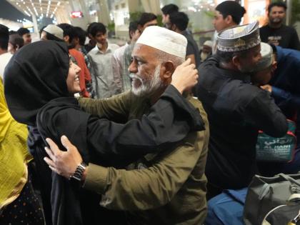 A man, centre right, breaks down as he hugs a relative at airport upon his arrival from Jeddah, in Ahmedabad, India, Wednesday, March 4, 2026. (AP Photo/Ajit Solanki)