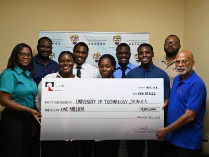 WINDALCO representatives (from left): Snr Information & Public Affairs Officer Monique Grange; Lead Reliability Engineer Judon Kerr; Snr Team Leader Stefan Keane, and Human Resources Director Glendon Johnson surround awardees Romone Dyer, Najae Nelson,  Ja