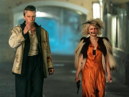 This image released by Warner Bros Entertainment shows Christian Bale and Jessie Buckley in a scene from ‘The Bride!’ 