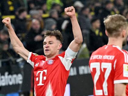 Bayern Munich’s Joshua Kimmich celebrates scoring during the Bundesliga match between Borussia Dortmund and FC Bayern Munich in Dortmund, Germany, on Saturday, February 28, 2026. 