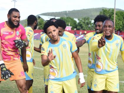 Waterhouse FC players celebrate after scoring against Portmore United during  their Jamaica Premier League football game at the Ferdi Neita Park Sports Complex in Portmore yesterday.