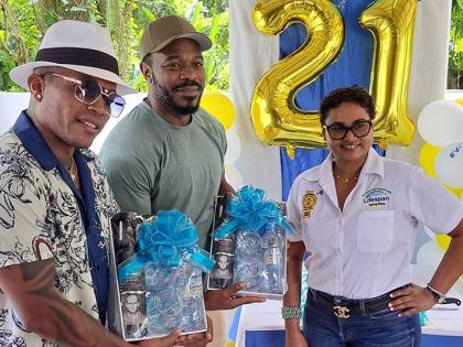 CEO of Lifespan Nayana Williams stands with brand ambassador Olaf Blackwood (left) and Lyriq Bent (centre), a Jamaican‑born Hollywood actor.