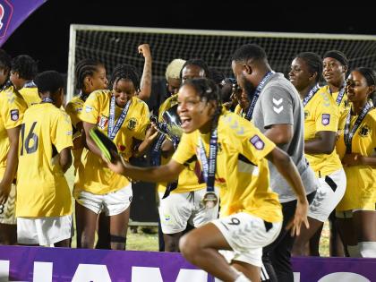 Members of Frazsiers Whip FC celebrate after winning the Jamaica Women’s Premier League football title last year.  They defeated Cavalier  4-1 in the final at Ashenheim Stadium, Jamaica College.