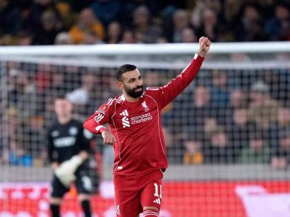 Liverpool’s Mohamed Salah celebrates after scoring his team’s  second goal of the game during an English FA Cup fifth round match against Wolverhampton Wanderers yesterday.
