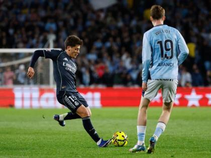 Real Madrid’s Arda Guler (left) moves to take a shot as Celta Vigo’s Williot Swedberg looks on during their Spanish La Liga in Vigo, Spain yesterday.