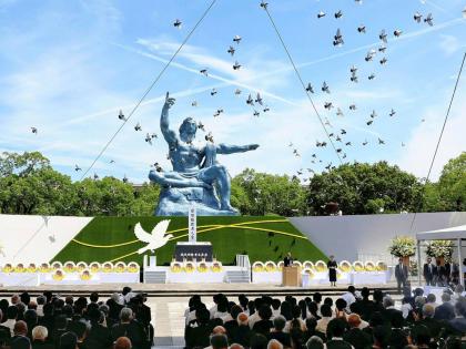 Doves fly over the Peace Statue during a ceremony to mark the 79th anniversary of the US atomic bombing at the Peace Park in Nagasaki, southern Japan August 9, 2024. 