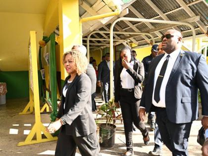 Minister of Education, Skills, Youth and Information, Senator Dr Dana Morris Dixon (left), is joined by Parliamentary Secretary in the Ministry, Senator Marlon Morgan (right), during a visit to the Ocho Rios High School in St Ann on Thursday, March 5,