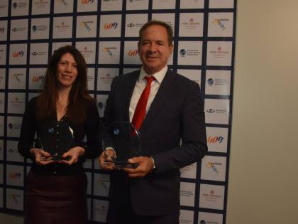 CEO of S Hotels Jamaica, Christopher Issa, and his UK representative, Victoria Cranmer, pose with the two awards they were recognised with at the PATWA International Travel Awards 2026 during the ITB trade show in Berlin, Germany, last Wednesday.