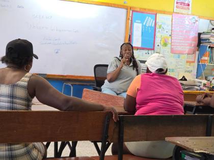 Letta Gayle, social worker at the Violence Prevention Alliance delivers a counselling session at Chalky Hill in St Ann.