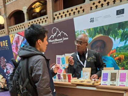 Averell French from Mount Pleasant Chocolate speaking with a buyer during the trade show.