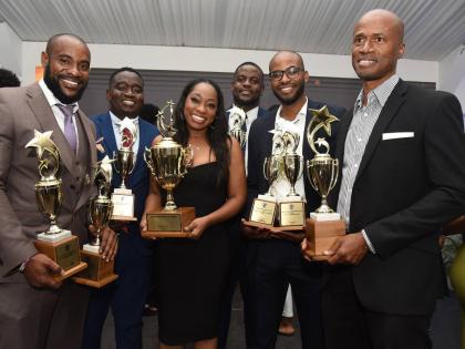 From left: The Gleaner’s Corey Robinson, Matthew McKoy, Kimone Francis, Antoine Lodge, Jovan Johnson, and Livern Barrett pose with their trophies after receiving awards at the National Journalism Awards held at the S Hotel on Saturday.
