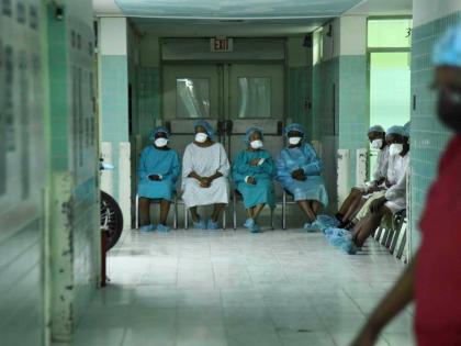 Surgical patients wait to be served inside the eye clinic at St Joseph’s Hospital in Kingston yesterday.
