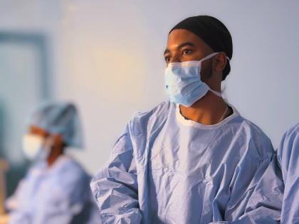 Dr O’Rane Thomas, lead surgeon performs the first laparoscopic colectomy at the Medical Associates Hospital.