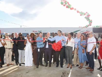 RUBiS leadership and guests at the ribbon‑cutting event for the company’s 50th flagship station on the Portmore Causeway. 
