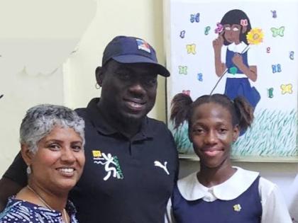From left: Convent of Mercy Academy (Alpha) principal, Kali McMorris, head coach, Kirk King, and athlete Imani Lowe. 