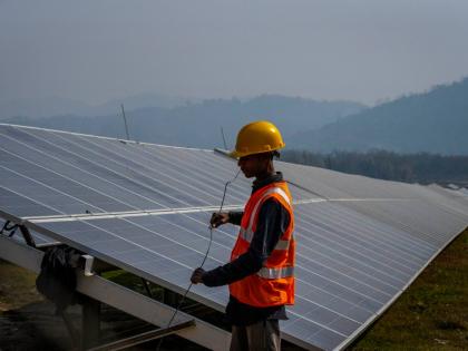 A man working at a solar power plant.