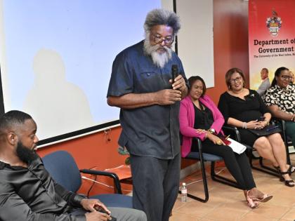 Dr Louis Moyston (second left), lecturer in the Department of Government at The University of the West Indies, Mona Campus,  speaks on ‘The resurgence of US Imperialism in the Region: Target Cuba’ while looking on (from left) are co-speakers Damion Gor