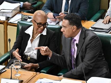 Prime Minister Dr. Andrew Holness (right) with Fayval Williams, minister of finance and the public service at the 2026/27 Budget Debate at Gordon House.