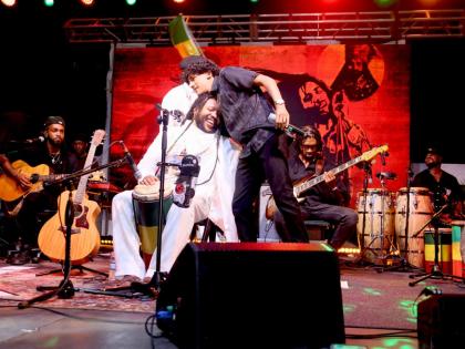 Elijah Marley embraces his uncle Stephen Marley during the tribute concert for Joseph ‘Jo Mersa’ Marley.