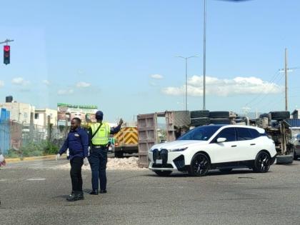 A policeman directing traffic at the scene of a crash along Marcus Garvey Drive in Kingston on March 16, 2026. 
