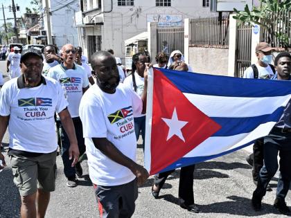 Supporters of Cuban medical professionals participate in the ‘Gratitude Walk’ to show gratitude and appreciation to the Cuban people for their 50 years of medical support to the Jamaican people. The group walked from Hanover Street to Heroes Circle in 