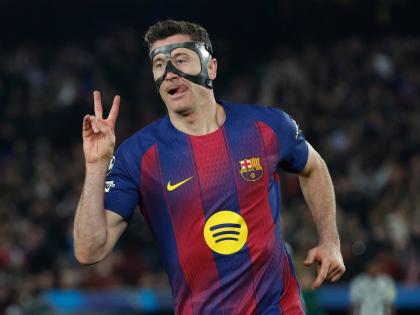Barcelona's Robert Lewandowski celebrates after scoring his side's sixth goal during the Champions League round of 16, second leg football match between FC Barcelona and Newcastle United FC in Barcelona, Spain on March 18, 2026. (AP Photo/Joan Monfort)

