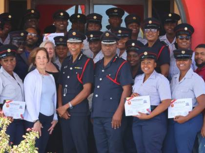 Commissioner, Jamaica Fire Brigade (JFB), Stewart Beckford (fourth left, front row), and Assistant Commissioner, Andrew Russell (fifth left), share a photo with the first cohort of Emergency Telecommunicators, along with facilitators of the Emergency Telec