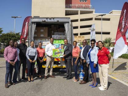 GraceKennedy presents essential hygiene and household products donated by Procter & Gamble to the Ministry of Health and Wellness on March 6 at the GraceKennedy Headquarters in downtown Kingston.