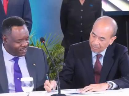 President of the Jamaica Employers’ Federation (JEF), Wayne Chen (right), and Caribbean Examinations Council (CXC) Registrar and CEO, Dr Wayne Wesley, sign the Partnership Engagement Agreement (PEA) during the 2026 CXC Ministerial Forum opening ceremony,