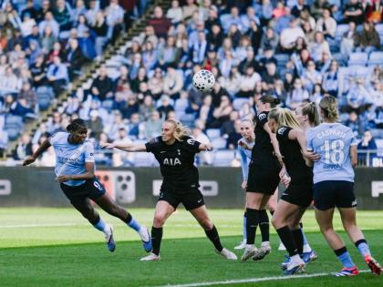 Courtesy of mancity.com 
Manchester City and Jamaica striker Khadija Shaw (left) plants a powerful header on her way to scoring one of three goals in a Women’s Super League game against Tottenham Hotspur at the Joie Stadium in Manchester, England yesterd