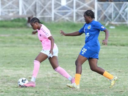 Frazsiers Whip’s Kersha Thomas dribbles away from Springers United FC’s Jasheika Harris during a Jamaica Women’s Premier League fixture at the Excelsior High School on Saturday.