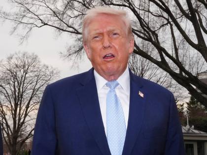 President Donald Trump speaks with reporters before departing on Marine One from the South Lawn of the White House, Friday, March 20, 2026, in Washington. (AP Photo/Alex Brandon)