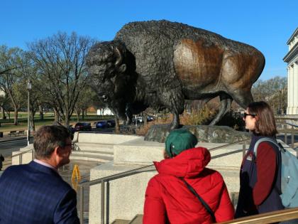 Bison statues cast in bronze are on permanent display outside the Smithsonian’s National Museum of Natural History.