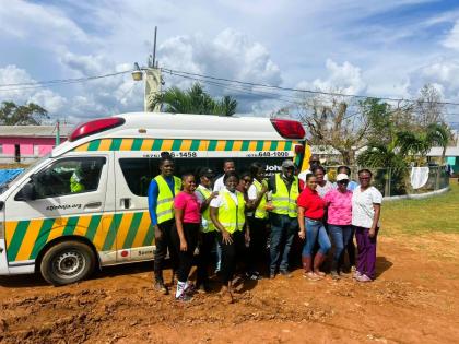 St John Ambulance medical team and volunteers pose for a photo during one of their visits to assist persons in western Jamaica parishes affected by Hurricane Melissa. 