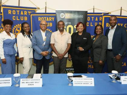 Mayor of Kingston Andrew Swaby (centre) and District Governor for Rotary District 7020, Professor William ‘Bill’ Aiken (third from left) and wife, Dr Ella Britton-Aiken (second from left), share the spotlight with sponsors and conference planning commi