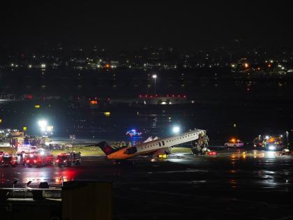 An Air Canada Jet sits on the runway at LaGuardia Airport on March 23, 2026, after colliding with a Port Authority aircraft rescue and firefighting vehicle in New York. (AP Photo/Ryan Murphy)