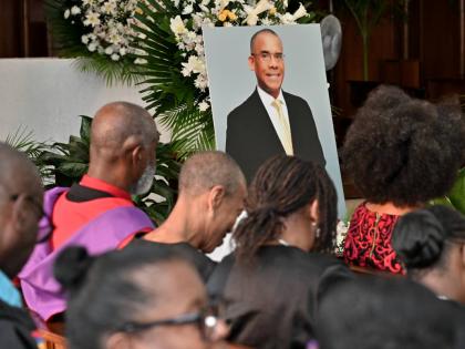 Mourners at the funeral for Dr Tomlin Paul, the late deputy principal of The University of the West Indies, Mona, held yesterday at the University Chapel in St Andrew. 