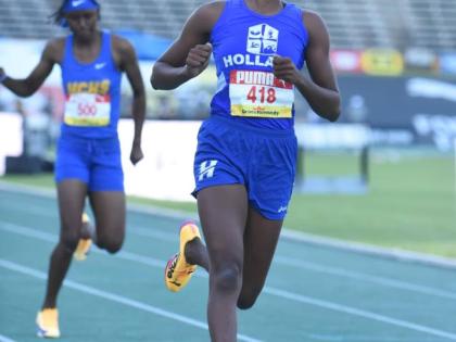 Holland High’s Shanoya Douglas runs 11.85 seconds to win her heat and advance to the Girls’ Class One 100m semifinals at the ISSA/GraceKennedy Boys and Girls’ Athletics Championships on March 24, 2026. (Ian Allen photo)