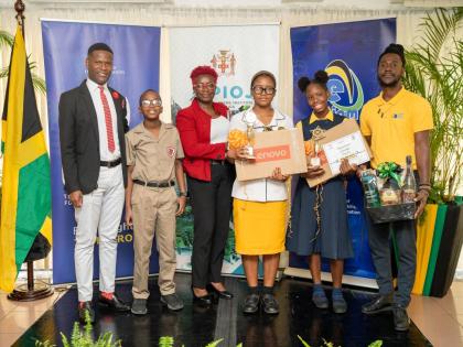 From left: Dwayne Cameron, art teacher at Campion College, with Bryce Wilson, winner of the lower‑secondary cover design challenge; Kate Smith Moulton of York Castle High School with upper‑secondary story winner Haley Clarke; and teacher Jason Richard 
