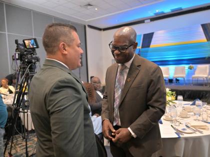 Matthew Samuda, minister of water, environment and climate change, speaks with Ansord Hewitt, director general of the Office of Utilities Regulation (OUR) at the 12th Annual Director General’s Stakeholders’ Engagement held last Thursday at The Jamaica 