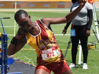 Port Antonio’s Xavier Jones gets ready to throw during the Class 2 Girls’ shot put on yesterday’s opening day at the ISSA/GraceKennedy Boys and Girls’ Athletics Championships at the National Stadium.