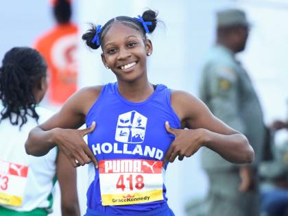 Holland High School’s Shanoya Douglas was relaxed after winning her Class 1 100-metre heat at yesterday’s ISSA/GraceKennedy Boys and Girls’ Athletics Championships inside the National Stadium yesterday.